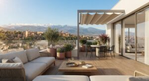 Terraza moderna de una vivienda de obra nueva en Granada con mobiliario exterior y vistas a Sierra Nevada.
